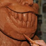 finition du visage de troll tetram ebauche sculpture attakus collection